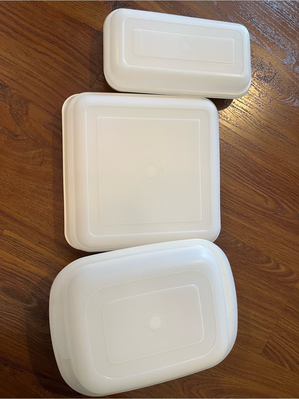 Set of three Tupperware Ovenware containers.